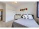 Bedroom featuring carpet, a window, closet, dresser and decor at 14700 E 104Th Ave # 1404, Commerce City, CO 80022