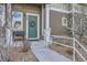Inviting entryway featuring a green front door with wreath and well-maintained landscaping at 14700 E 104Th Ave # 1404, Commerce City, CO 80022