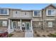 Charming townhouse featuring a well-maintained front exterior with a cozy entrance and landscaped surroundings at 14700 E 104Th Ave # 1404, Commerce City, CO 80022