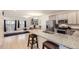 Stylish kitchen featuring granite countertops, stainless steel appliances, and an open layout flowing into the dining and living areas at 14700 E 104Th Ave # 1404, Commerce City, CO 80022