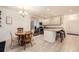 Open concept kitchen with granite counters, stainless steel appliances, and a seamless flow into the dining area at 14700 E 104Th Ave # 1404, Commerce City, CO 80022