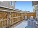 Private outdoor patio area enclosed by a wooden fence, perfect for relaxing at 14700 E 104Th Ave # 1404, Commerce City, CO 80022
