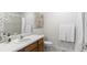 Clean bathroom features a wood vanity, white countertops, and neutral decor at 15543 Quivas St, Broomfield, CO 80023