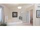 A bathroom featuring a soaking tub, a shower and a modern light fixture at 15543 Quivas St, Broomfield, CO 80023
