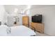 The bedroom features a ceiling fan, a window with natural light, and wooden furnishings at 15543 Quivas St, Broomfield, CO 80023