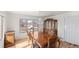 Elegant dining room with a wood table, a crystal chandelier, and a classic china cabinet at 15543 Quivas St, Broomfield, CO 80023