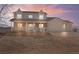 Charming two-story home with a welcoming front porch and a three car garage at 15543 Quivas St, Broomfield, CO 80023