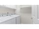 Functional laundry area equipped with modern washer and dryer units and shelving for storage at 15543 Quivas St, Broomfield, CO 80023