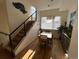 Sunlit dining room features a wood table set, hardwood floors, and a large picturesque window at 1284 Osceola St, Denver, CO 80204