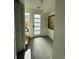 Bright entryway features stylish gray flooring and modern door at 1284 Osceola St, Denver, CO 80204