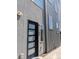 Modern home exterior showcasing a stylish front door and clean architectural lines at 1284 Osceola St, Denver, CO 80204