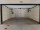 Spacious, empty garage featuring an open layout and ample storage shelving at 1284 Osceola St, Denver, CO 80204