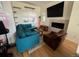 Comfortable living room with a plush sectional sofa, fireplace, and modern decor at 1284 Osceola St, Denver, CO 80204