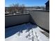 This rooftop deck features snow, deck pavers and great views at 1284 Osceola St, Denver, CO 80204