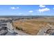 Aerial view of a community with walking trails and mountain views at 7967 E 139Th Pl, Thornton, CO 80602