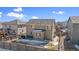 Home's backyard features a concrete patio and wooden fence at 7967 E 139Th Pl, Thornton, CO 80602
