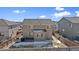 Home's backyard features a concrete patio and wooden fence at 7967 E 139Th Pl, Thornton, CO 80602