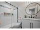 Modern bathroom featuring black hardware, white subway tile, and a stylish shower at 7967 E 139Th Pl, Thornton, CO 80602