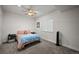 Cozy bedroom featuring soft gray carpet, white walls, and a ceiling fan at 7967 E 139Th Pl, Thornton, CO 80602