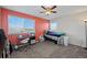 Cozy bedroom with a twin bed, desk by the window, and ceiling fan at 7967 E 139Th Pl, Thornton, CO 80602