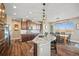 Gourmet kitchen boasts granite countertops, stainless steel appliances, and a breakfast bar at 7967 E 139Th Pl, Thornton, CO 80602