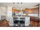 Gourmet kitchen boasts granite countertops, stainless steel appliances, and a breakfast bar at 7967 E 139Th Pl, Thornton, CO 80602