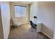 Cozy bedroom featuring a stylish chair and a modern desk with ample natural light at 6321 Spring Gulch St, Frederick, CO 80516