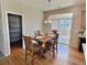 Dining area with easy access to the pantry and backyard, perfect for entertaining and enjoying indoor-outdoor living at 6321 Spring Gulch St, Frederick, CO 80516