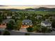 Picturesque aerial view of a home nestled in a serene community with mountain views at 5322 Devils Head Cir, Golden, CO 80403