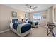 Cozy bedroom featuring two twin beds, soft carpet, neutral walls, and a bright window at 5322 Devils Head Cir, Golden, CO 80403