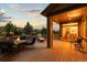 Inviting outdoor deck with fire pit and seating, ideal for relaxation and enjoying mountain views at 5322 Devils Head Cir, Golden, CO 80403