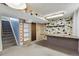 Spacious basement featuring unique tile accents and built-in shelving at 380 E 111Th Pl, Northglenn, CO 80233