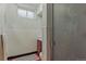 Tiled bathroom features a shower and medicine cabinet at 380 E 111Th Pl, Northglenn, CO 80233