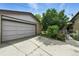 Detached garage with concrete driveway and gated access to the backyard at 380 E 111Th Pl, Northglenn, CO 80233