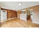 Living room with hardwood floors and access to the kitchen at 380 E 111Th Pl, Northglenn, CO 80233
