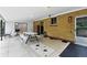 Covered brick patio with a picnic table and outdoor cooking space at 380 E 111Th Pl, Northglenn, CO 80233