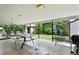 Open patio with outdoor seating, grill, and decorative tile flooring overlooking backyard at 380 E 111Th Pl, Northglenn, CO 80233