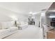 Spacious basement with neutral carpeting, seating, and a view of the stairwell at 1220 Magnolia St, Denver, CO 80220
