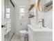 Clean bathroom features glass enclosed shower and modern vanity at 1220 Magnolia St, Denver, CO 80220