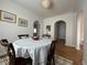 Cozy dining room featuring hardwood floors, a round table with seating, and warm lighting at 1220 Magnolia St, Denver, CO 80220