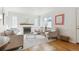 Sunlit living room offers hardwood floors, fireplace, and tasteful decor at 1220 Magnolia St, Denver, CO 80220