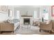 Bright living room boasts hardwood floors, fireplace, and light, neutral decor at 1220 Magnolia St, Denver, CO 80220