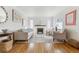 Inviting living room features a fireplace, hardwood floors, and neutral decor at 1220 Magnolia St, Denver, CO 80220