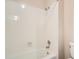 Clean bathroom with a shower and tub combo at 6141 W Evans Pl, Lakewood, CO 80227