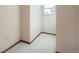Bright bedroom featuring neutral walls, carpeted floor, and window at 6141 W Evans Pl, Lakewood, CO 80227