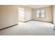 Bright and spacious bedroom with carpet and baseboard trim at 6141 W Evans Pl, Lakewood, CO 80227