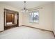 Empty dining room showing the ample space at 6141 W Evans Pl, Lakewood, CO 80227