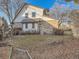 Charming home exterior with brick accents and mature landscaping at 6141 W Evans Pl, Lakewood, CO 80227