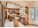 A stylish kitchen with stainless steel appliances, and center island at 6141 W Evans Pl, Lakewood, CO 80227