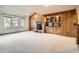 Living room with wooden fireplace and built-in cabinets at 6141 W Evans Pl, Lakewood, CO 80227